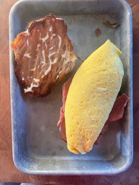 Assembling breakfast sandwich