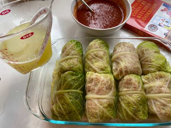 Cabbage rolls in pan before stock